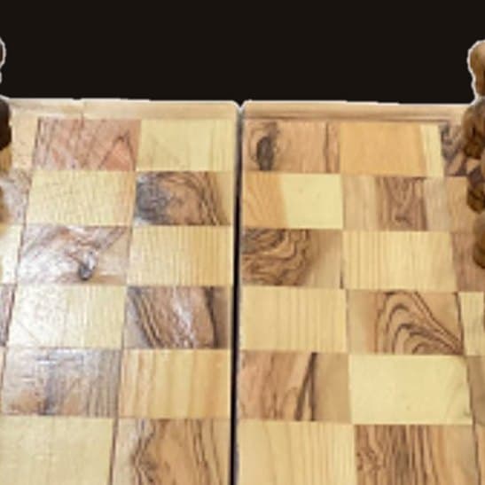 Close-up of Olive Wood Chess Set