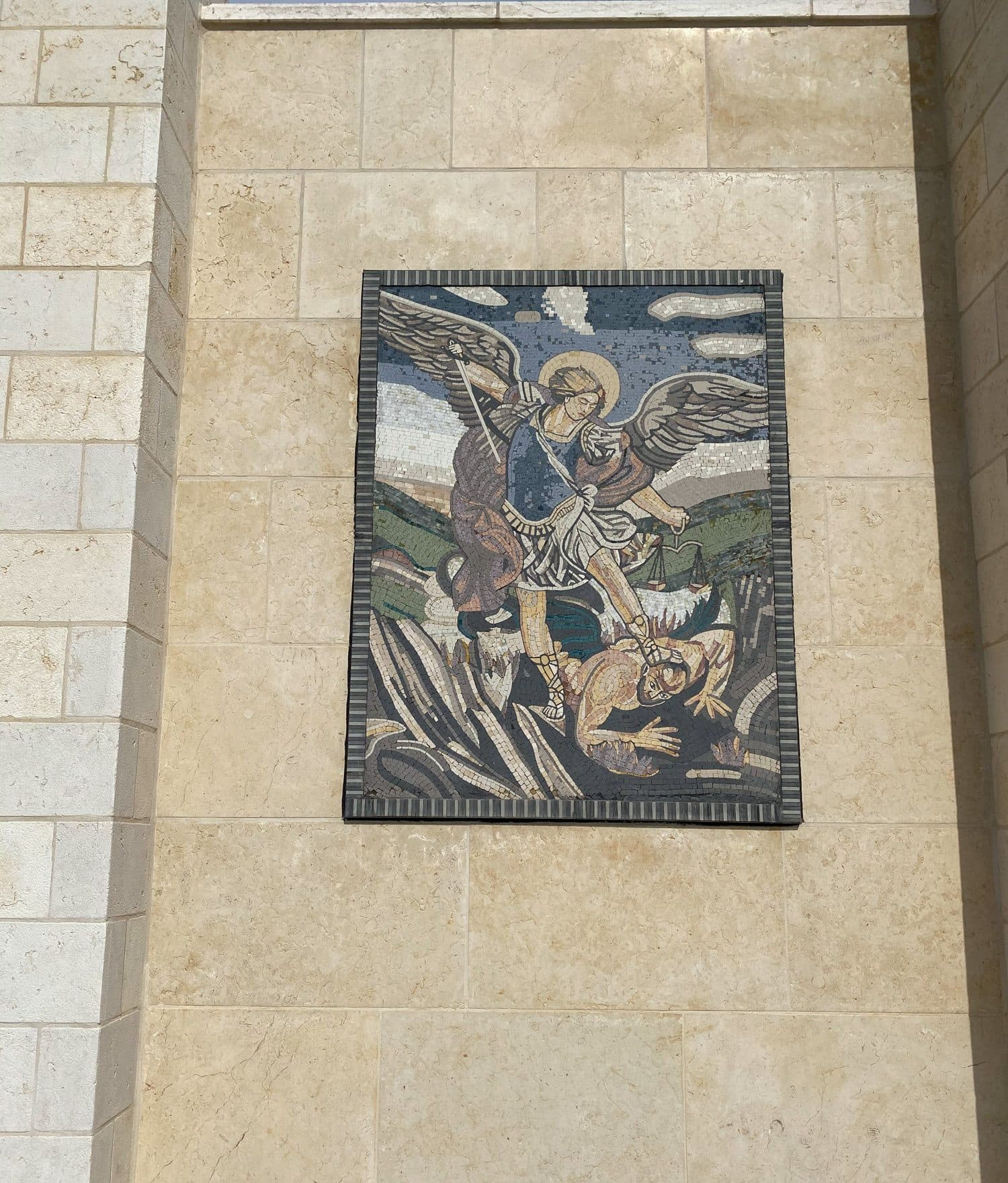 A mosaic of Saint Michael set into the limestone façade of the house in Bethlehem