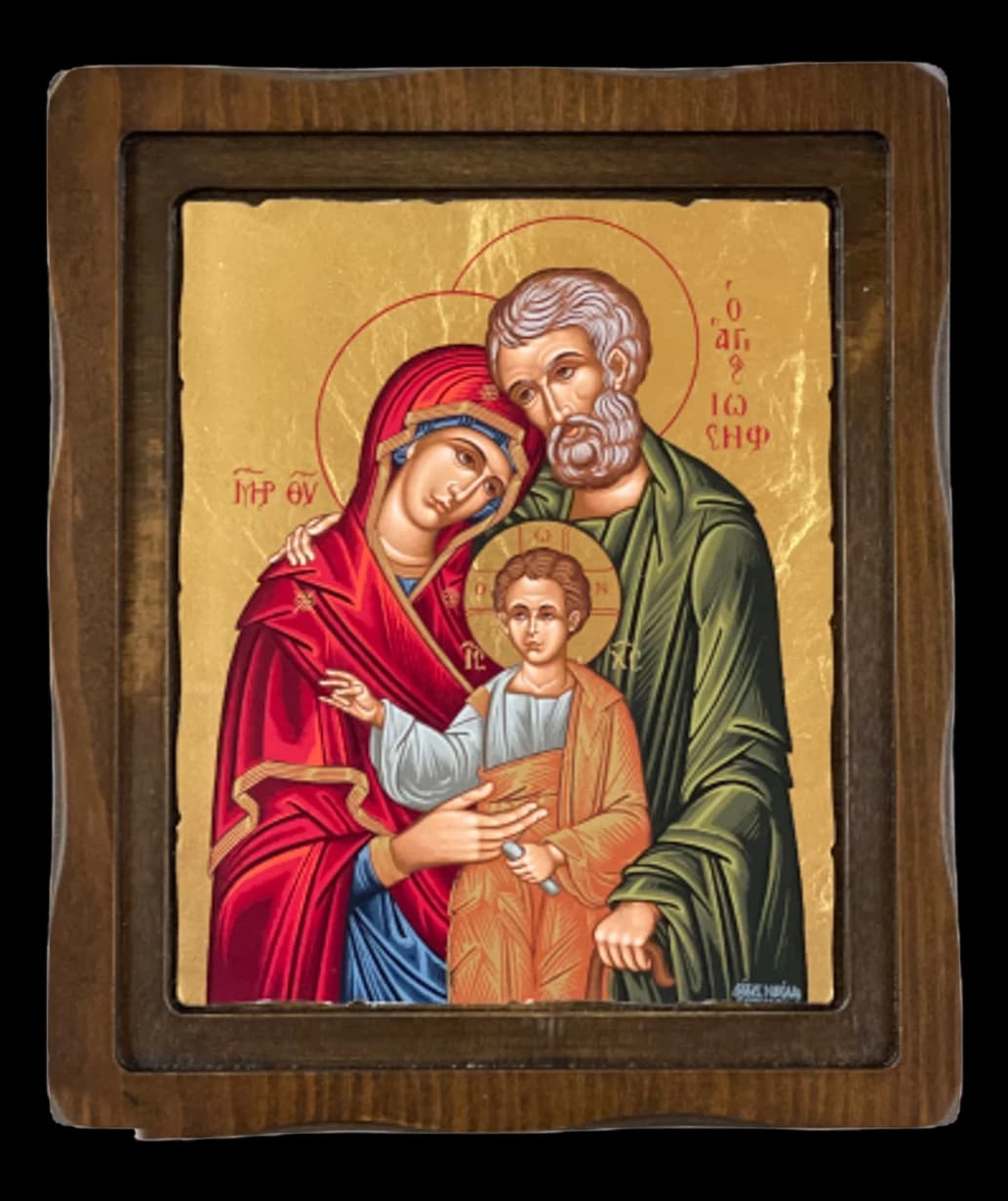 Icon of the Holy Family on a gold ground set in a dark wooden frame