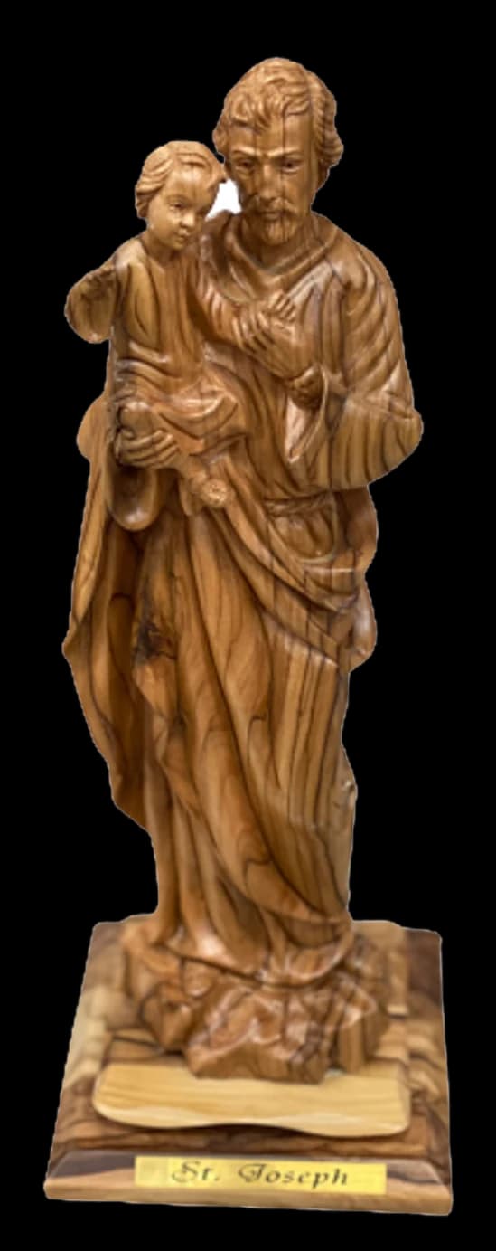 Olive wood carving of Saint Joseph standing and holding the infant Jesus
