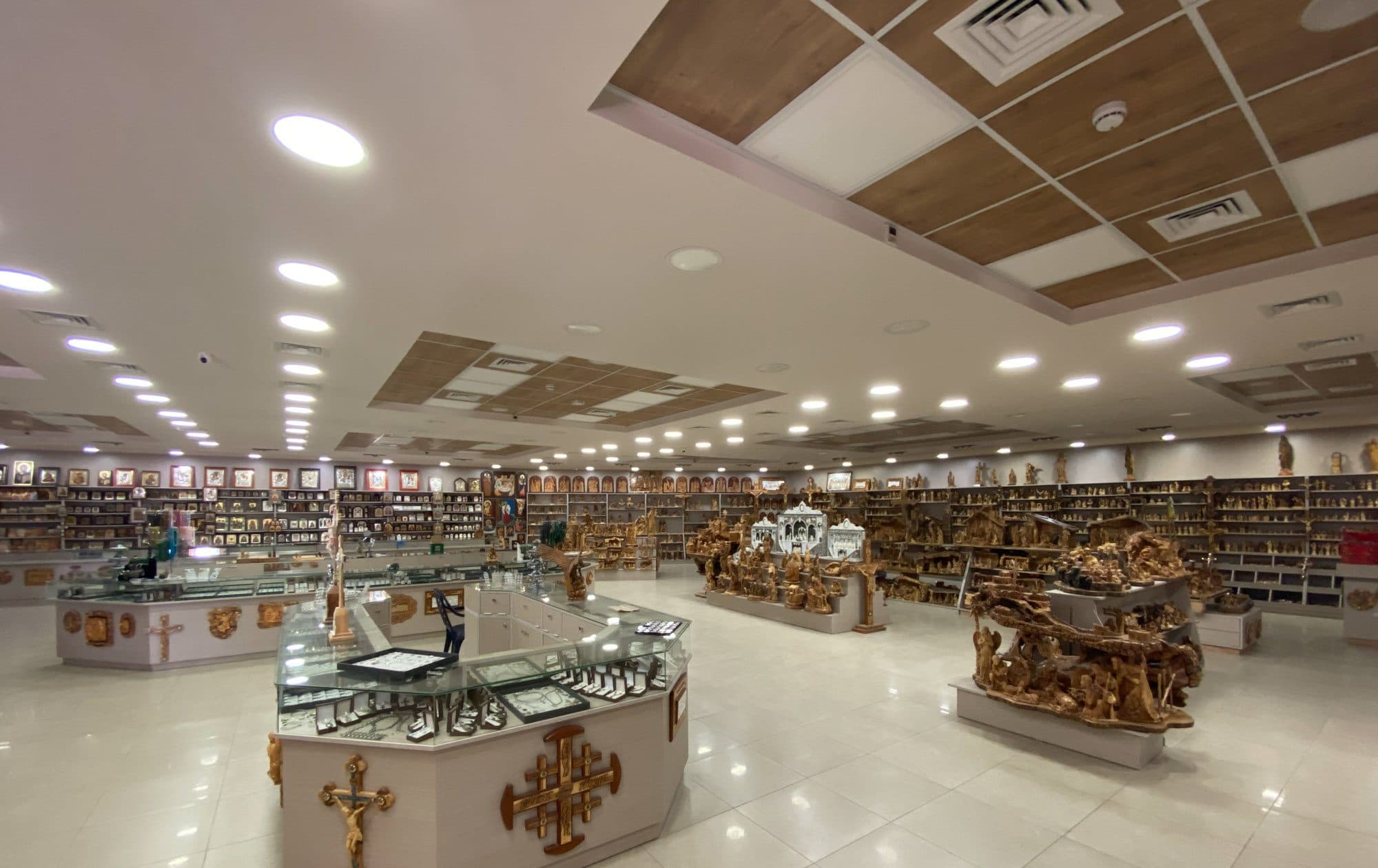 Inside the house: display cases and olive wood carvings
